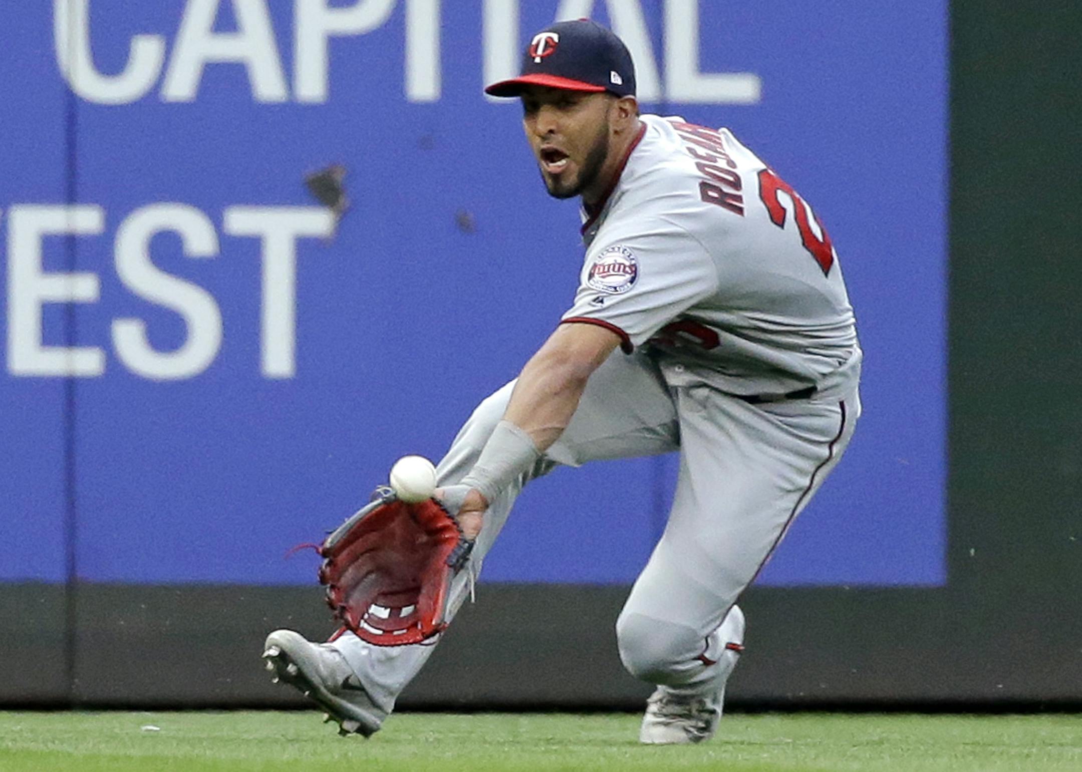 Minnesota Twins left fielder Eddie Rosario races in and catches a line drive from Seattle Mariners' Guillermo Heredia during the first inning of a baseball game Wednesday, June 7, 2017, in Seattle. (AP Photo/Elaine Thompson)