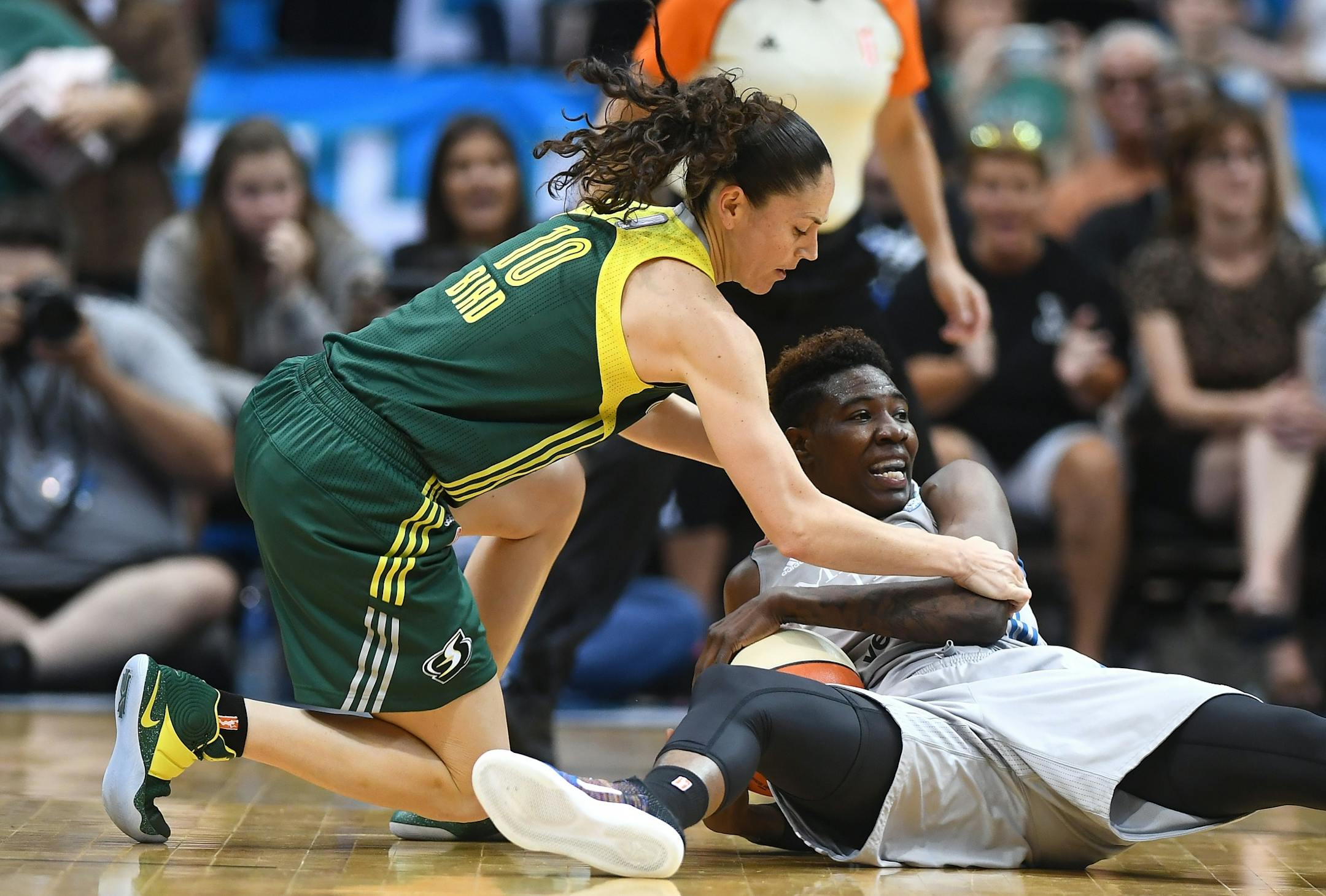 Minnesota Lynx forward Natasha Howard (3) and Seattle Storm guard Sue Bird (10) battled for a loose ball in the second quarter Friday, leading to a jump shot.