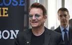 FILE - In this Sept. 17, 2016 file photo, Bono arrives at the Global Fund conference in Montreal. Bono will be honored as Glamour magazine's first Man