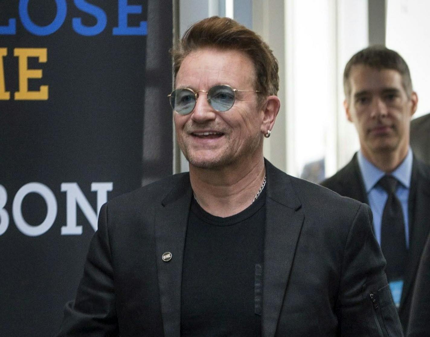 FILE - In this Sept. 17, 2016 file photo, Bono arrives at the Global Fund conference in Montreal. Bono will be honored as Glamour magazine's first Man of the Year among the magazine's Women of the Year recipients, on Nov. 14 in Los Angeles.