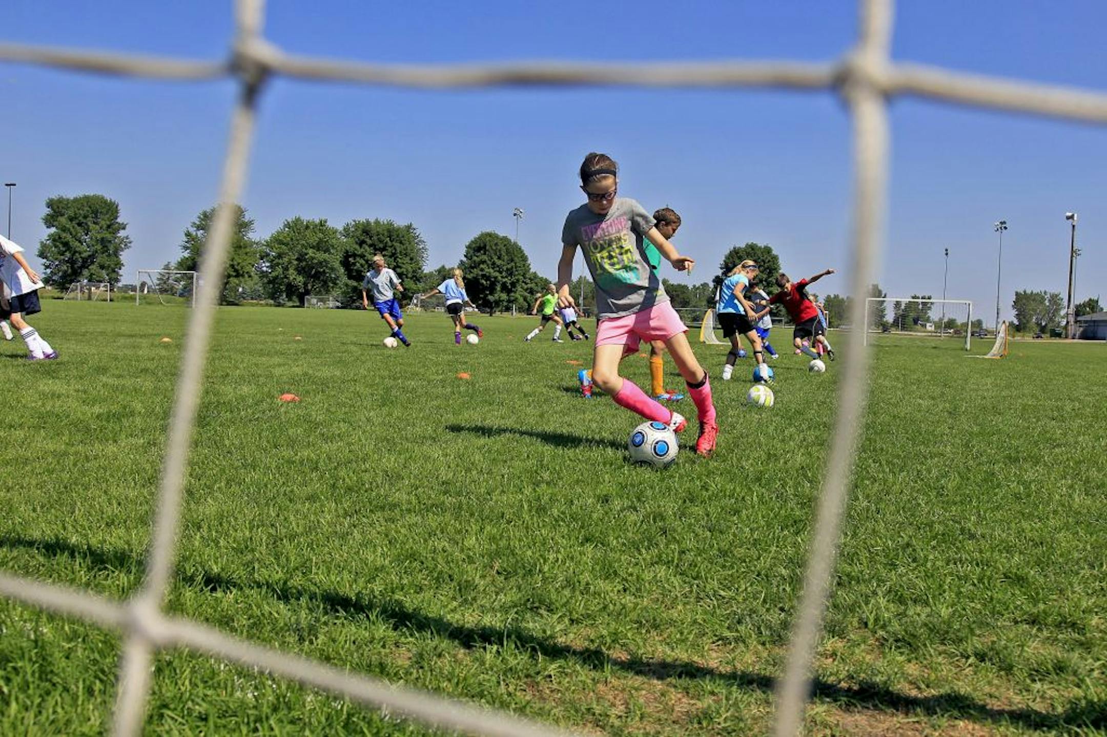 Kids in the Pegasus soccer camp practiced in one of the many soccer fields at the National Sports Center in Blaine. After years of building success in youth soccer and other sports, the center might expand to include baseball and softball.