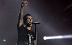 Adam Levine of Maroon 5 performs at the Rock in Rio music festival in Rio de Janeiro, Brazil, Saturday, Sept. 16, 2017. (AP Photo/Silvia Izquierdo) OR