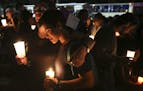 FILE - In this April 26, 2018 file photo, the journalism community holds a candlelight vigil in honor of slain journalist Angel Gahona who died on Apr