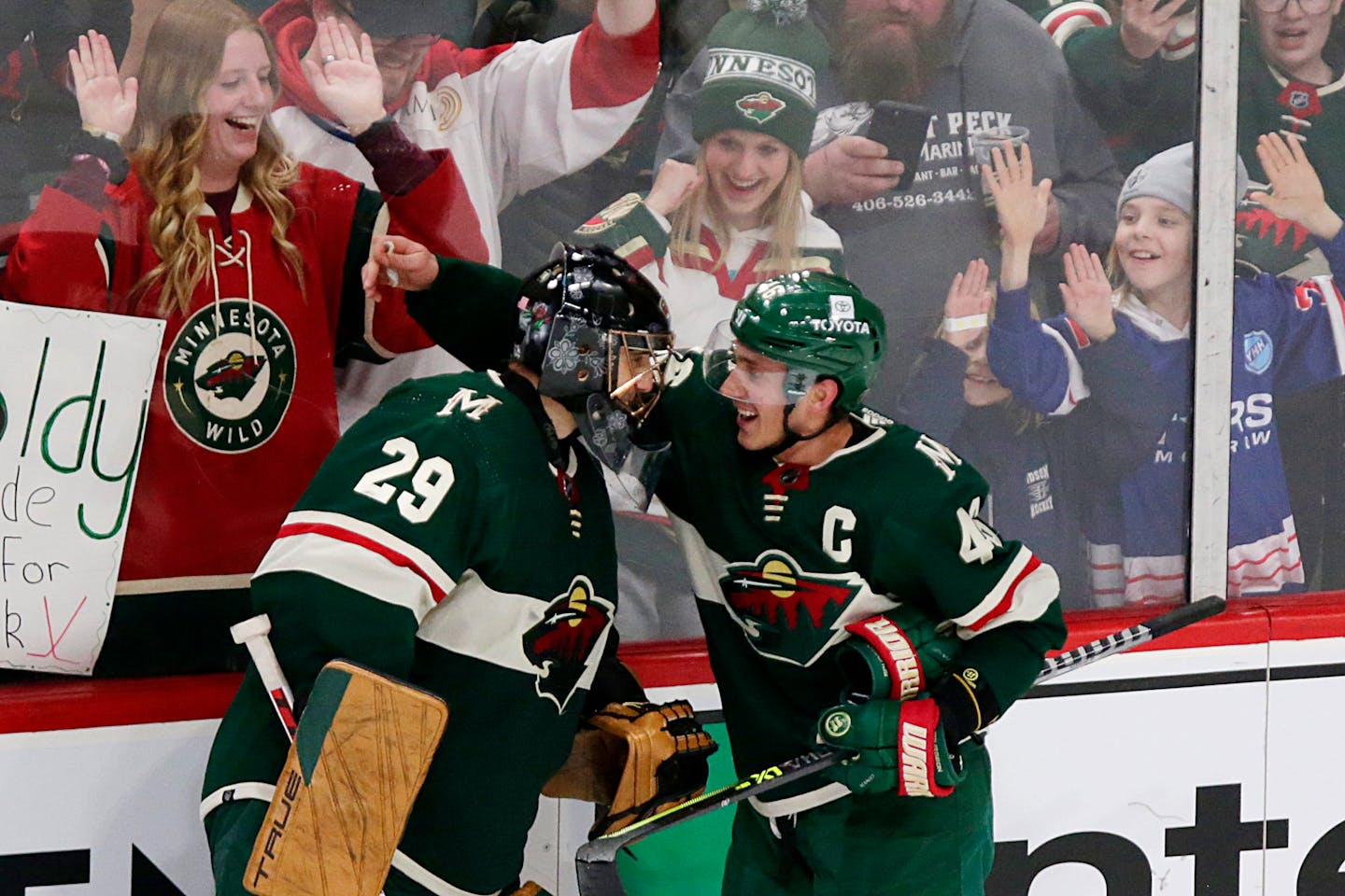 Minnesota Wild defenseman Jared Spurgeon (46) celebrates his winning goal with goaltender Marc-Andre Fleury (29) in overtime of an NHL hockey game against the Columbus Blue Jackets, Saturday, March 26, 2022, in St. Paul, Minn. (AP Photo/Andy Clayton-King)