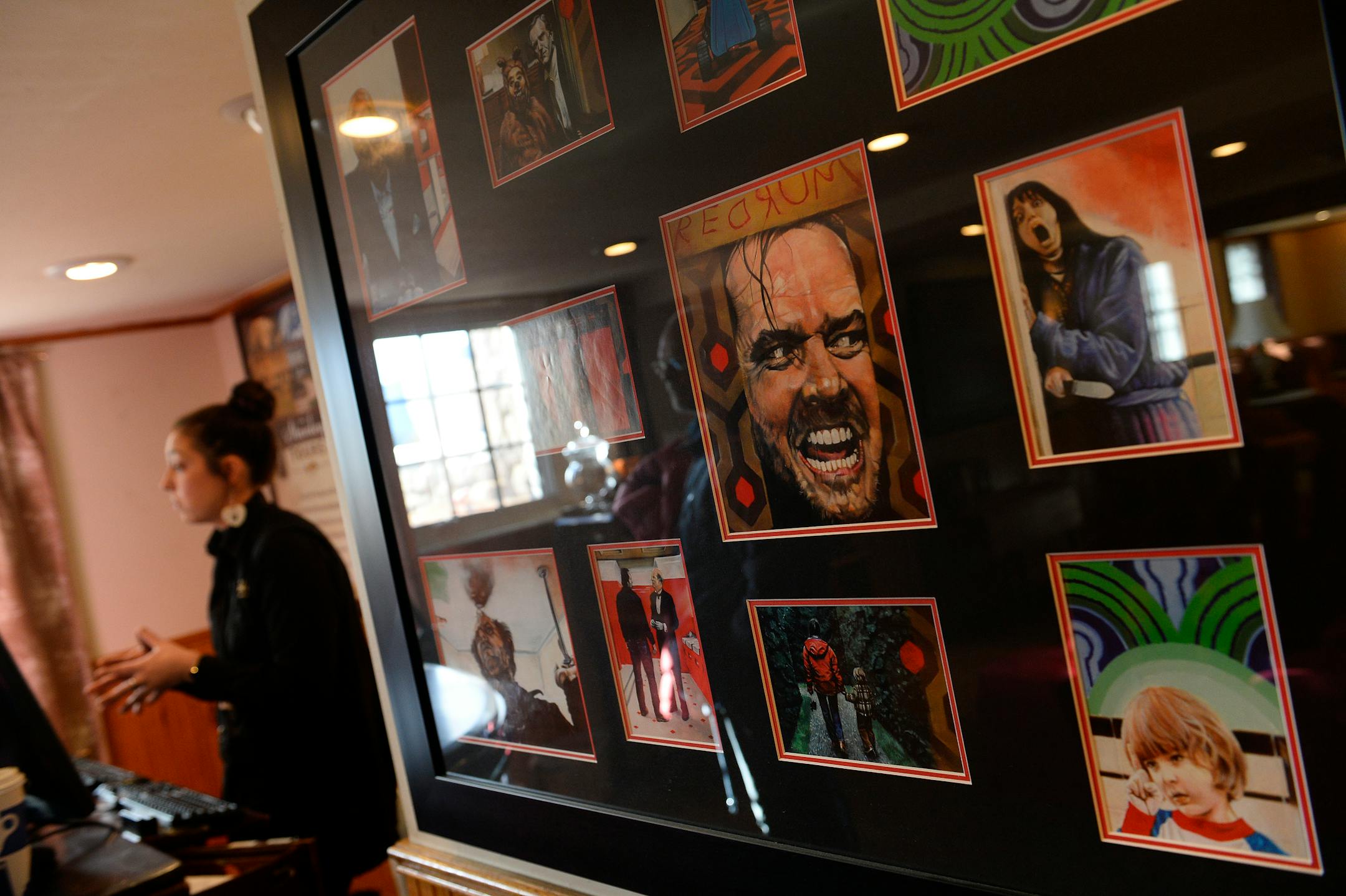 Tour guide Jofia Ross, left, talks to visitors next to a display of movie memorabilia from the popular movie "The Shining" at the Stanley Hotel on Jan. 12, 2016, in Estes Park, Colorado. (Helen H. Richardson/The Denver Post/TNS) ORG XMIT: 60101904W