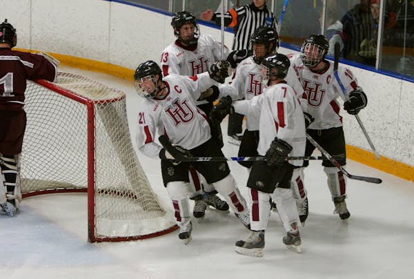 Hamline players celebrated a power-play goal in a 4-3 victory over Augsburg on Feb. 16. Over the weekend, the Pipers clinched their first MIAC regular
