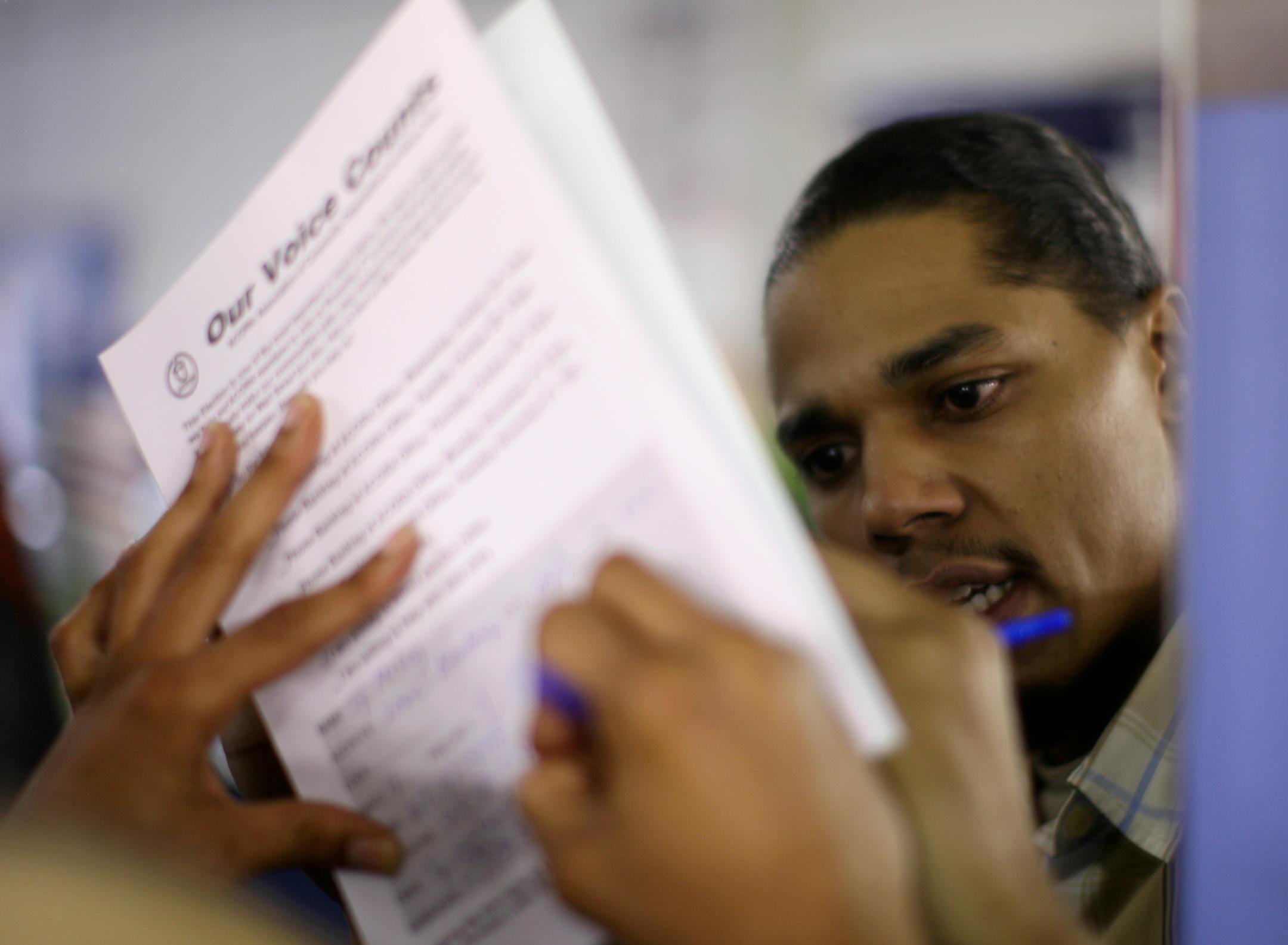 Minneapolis barber Ty McCoy formally signed up to volunteer with ACORN, which registered more than 43,000 Minnesotans as of last week.