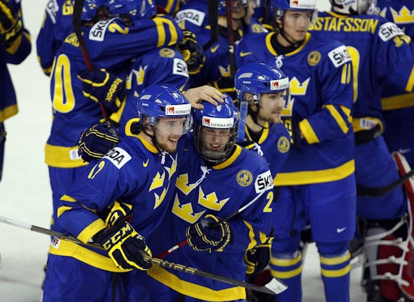 Wild draft pick Jonas Brodin, center, celebrated with Team Sweden at the world junior championships.
