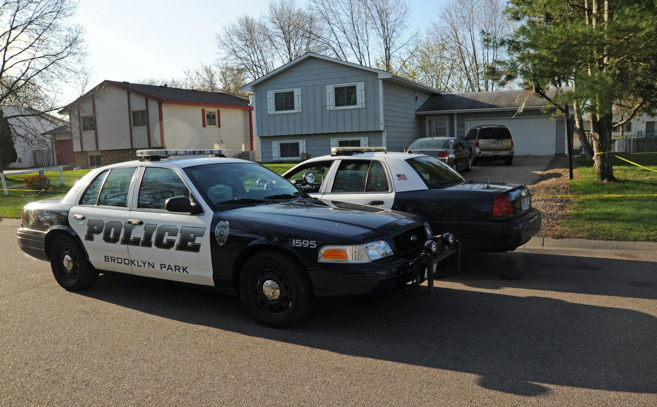 Police on Tuesday, April 10, 2012, investigated the scene of a fatal shooting where 3 people were found dead in Brooklyn Park, Minn.