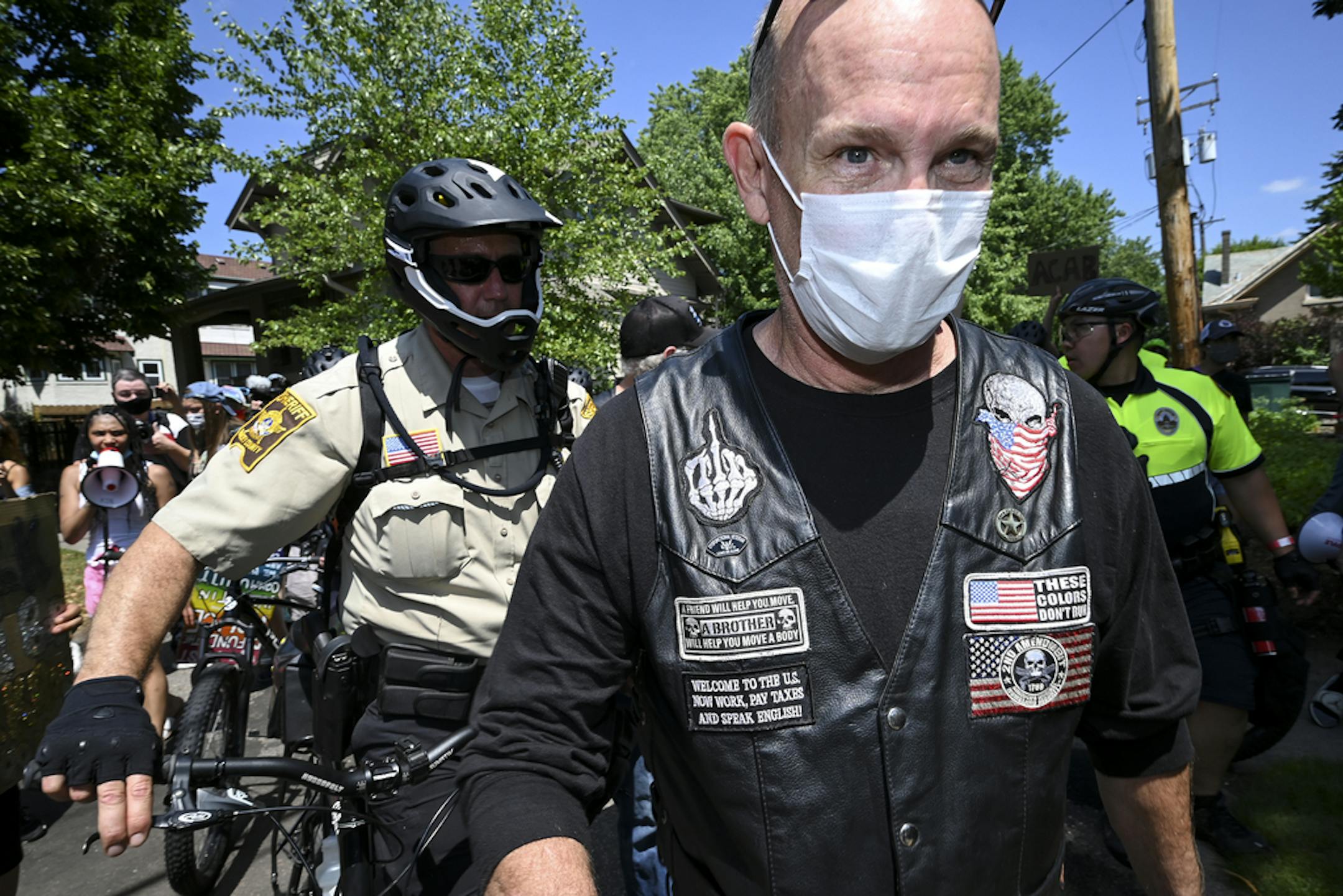 Ramsey County sheriff's deputies and St. Paul police escorted pro-police, pro-Trump demonstrators away from a June 27 protest at the governor's mansion in St. Paul after a heated confrontation with counterprotesters.
