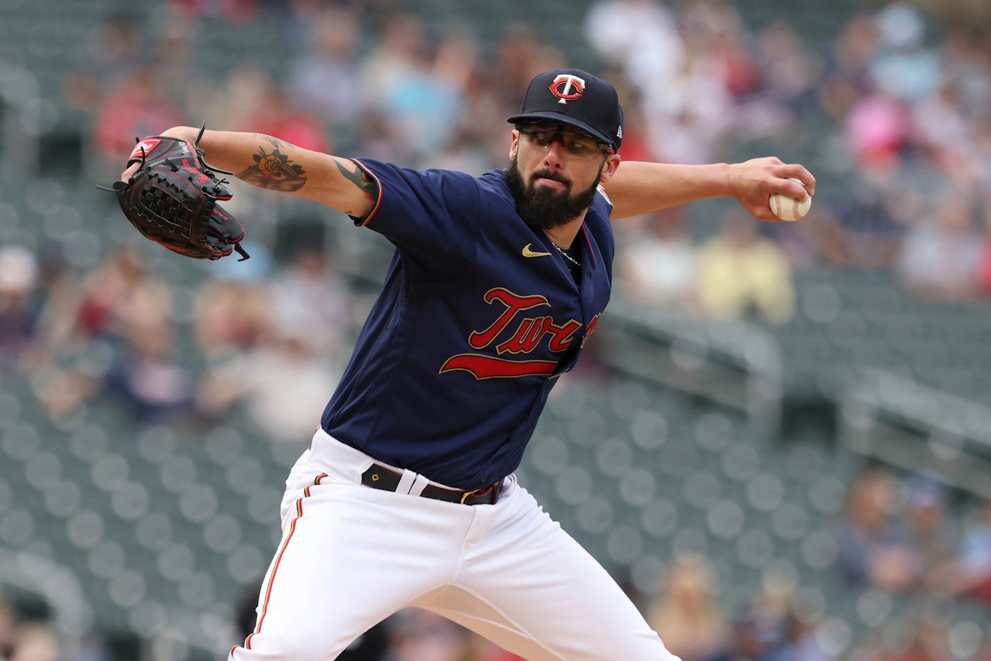 Minnesota Twins starting pitcher Devin Smeltzer (31) delivers a pitch during the first inning of the team's baseball game against the Tampa Bay Rays, Friday, June 10, 2022, in Minneapolis. (AP Photo/Stacy Bengs)