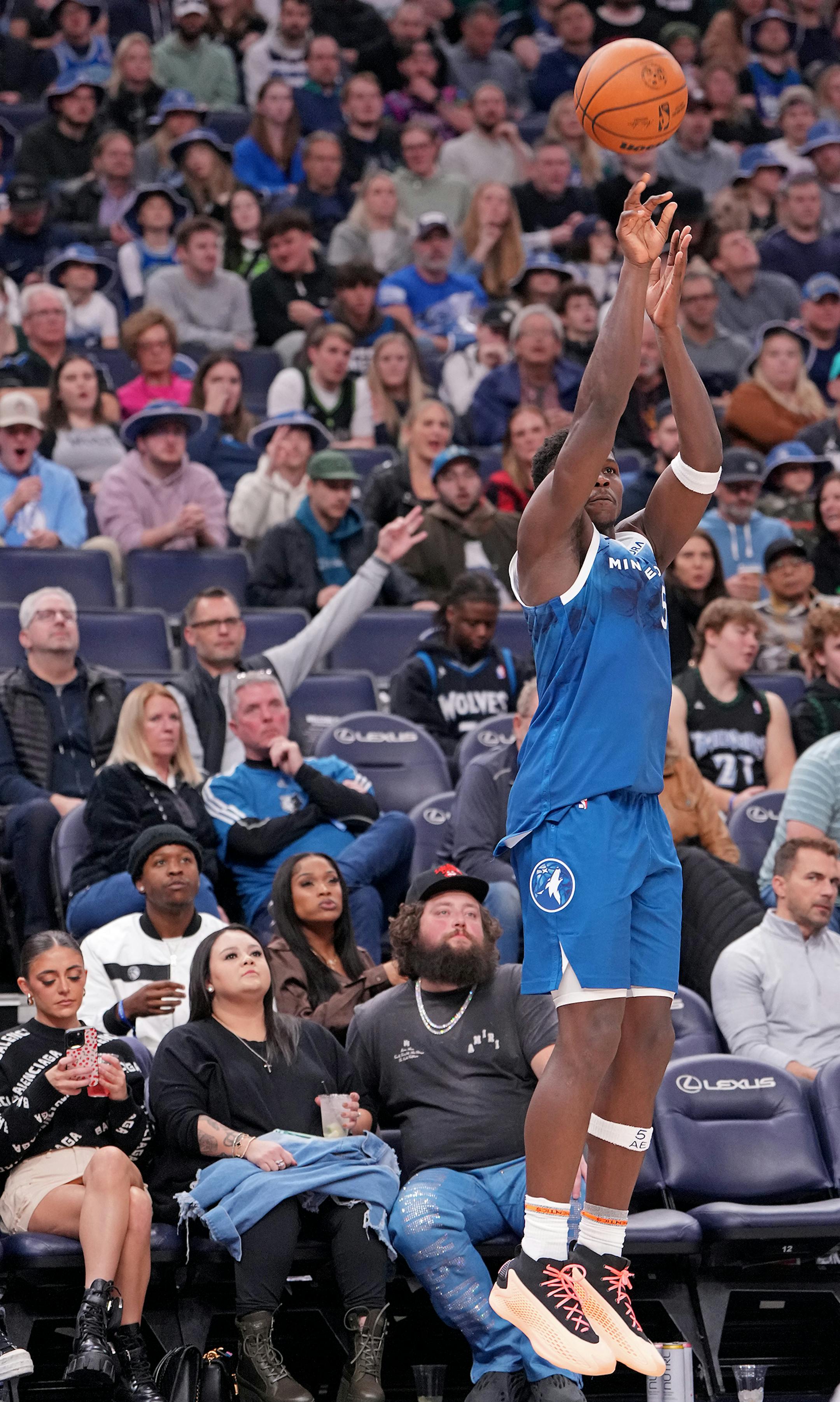 Minnesota Timberwolves guard Anthony Edwards (5) shoots a three-pointer during the second half of the game.