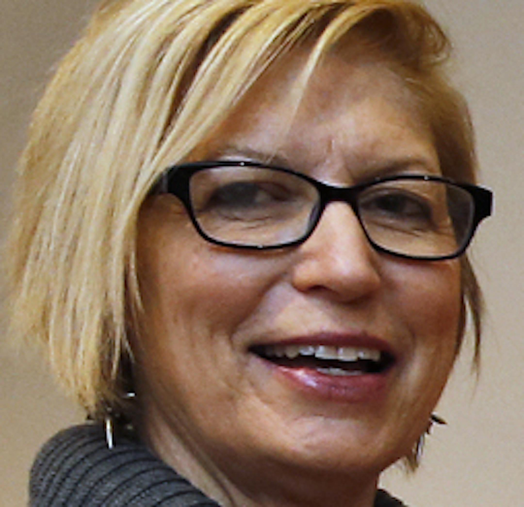 The Minneapolis Institute of Arts is launching an exhibition called "Sacred Salons" featuring sacred items collected from various cultures around the world. Museum curator Elizabeth Armstrong next to a 15th century bronze walking Buddha. (MARLIN LEVISON/STARTRIBUNE(mlevison@startribune.com) ORG XMIT: MIN1312201155292313