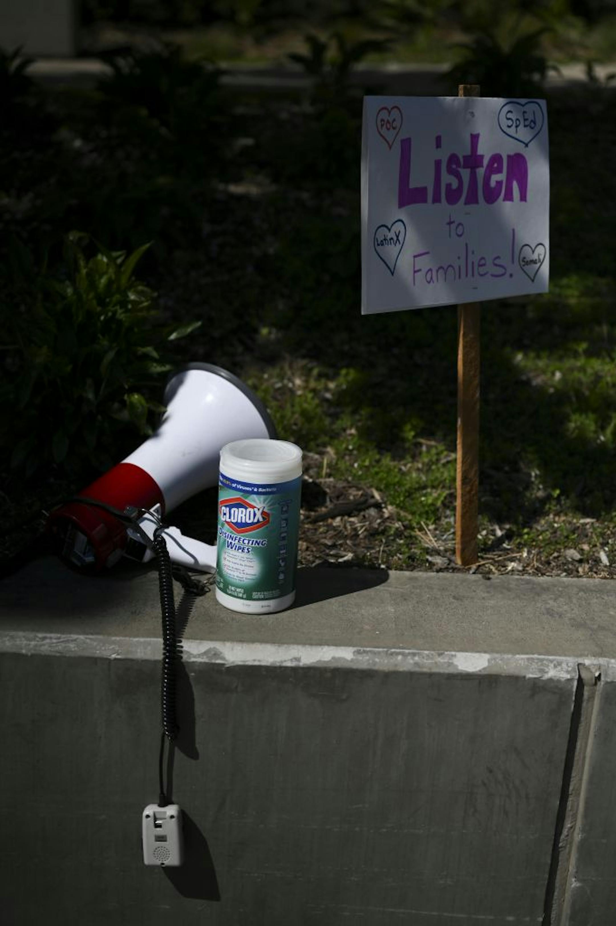 The tools of a modern protest, including a megaphone and Clorox wipes.