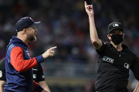 Twins manager Rocco Baldelli is ejected by third base umpire John Tumpane during the 10th inning of the team's game against the Cleveland Guardians on