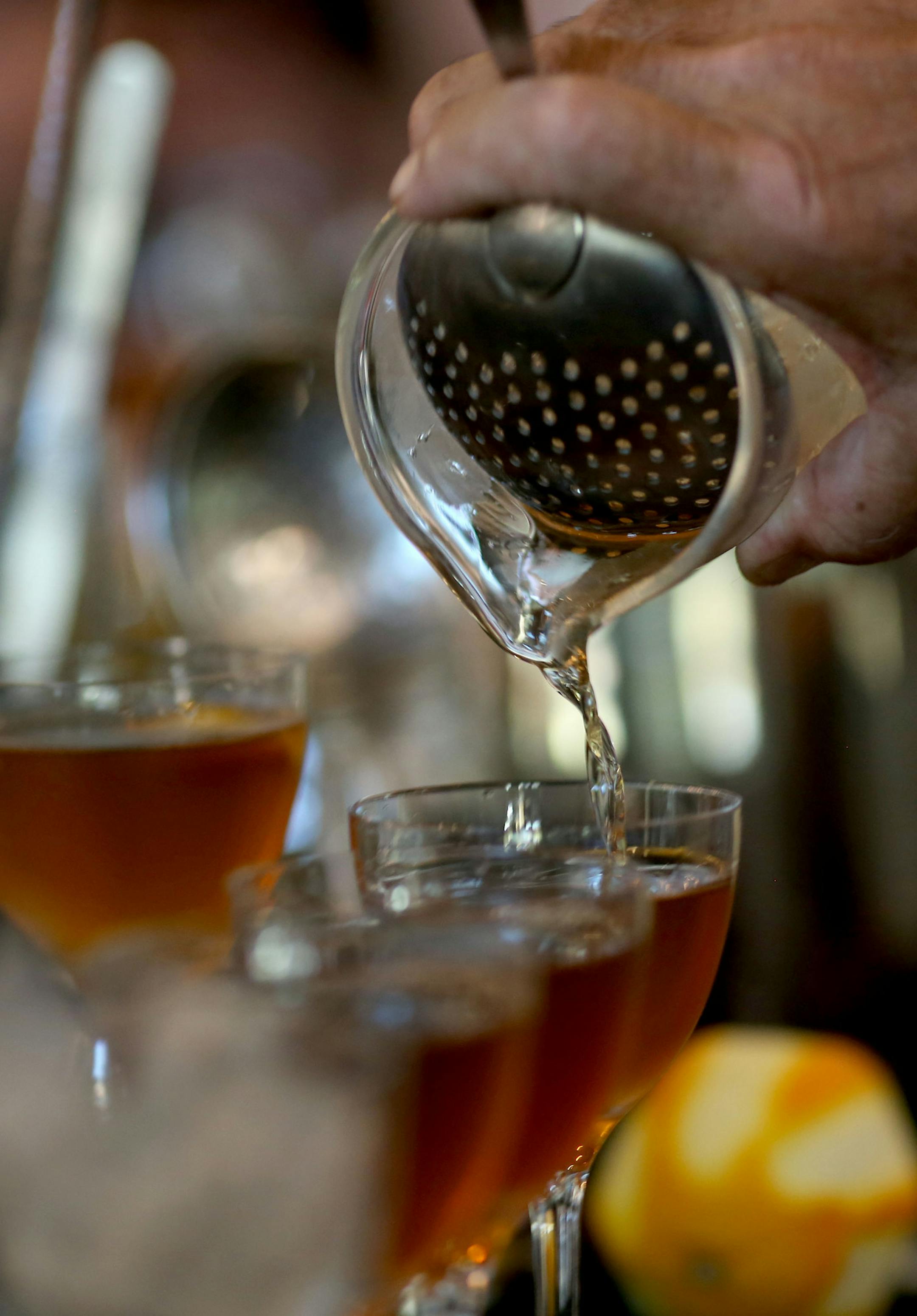Dale "King Cocktail" DeGroff poured Manhattans for a bunch local bartenders. ] (KYNDELL HARKNESS/STAR TRIBUNE) kyndell.harkness@startribune.com During a cocktail seminar at Coup d'Etat in Minneapolis Min., Tuesday, August, 26, 2014.