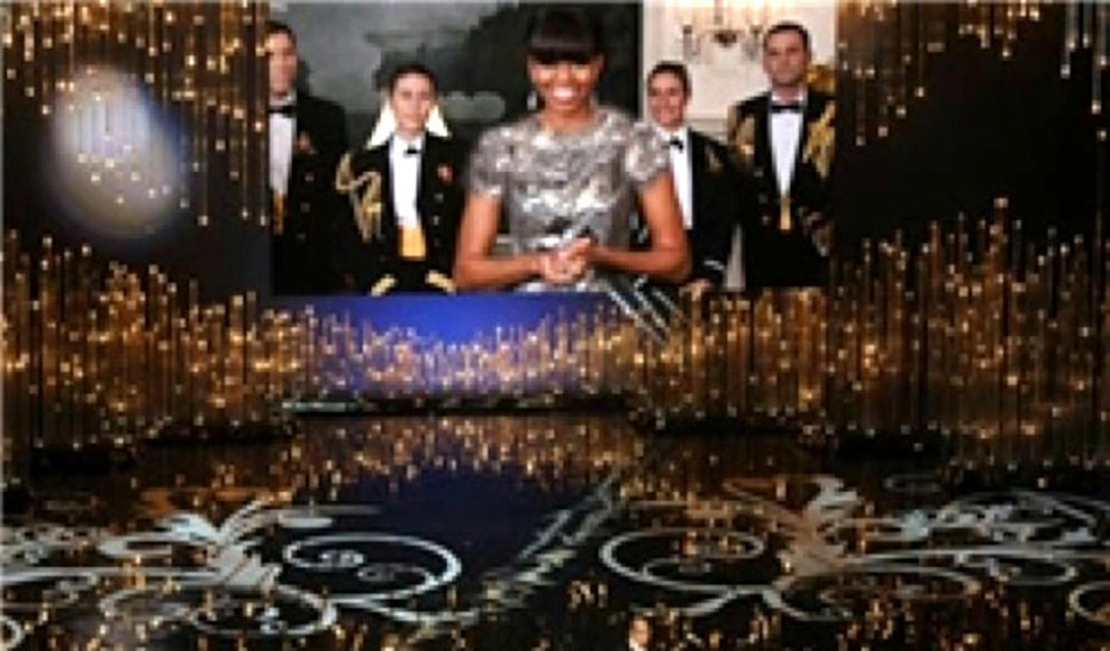 This screen grab taken from the website of Iran's semi-official Fars news agency shows an altered photo of U.S. first lady Michelle Obama presenting the best picture award at the Oscars ceremony via video link on Sunday, Feb. 24, 2013. The first lady wore a sleeveless, scoop neck gown for the occasion, but Fars ran this altered photo that covered her shoulders and neckline with added material. State TV showed images that blurred the parts of her body that were exposed. (AP Photo/Fars news agency