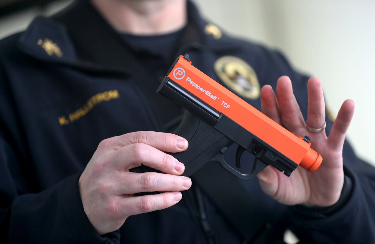 St. Paul Police Commander Kurt Hallstrom with a PepperBall launcherat at a downtown St. Paul Police Department training site Wednesday, Feb. 6, 209, in St. Paul, MN.] DAVID JOLES &#x2022;david.joles@startribune.com St. Paul police started a pilot program last week for what they call "PepperBall launchers," essentially an orange and black firearm that shoots marble-sized rounds of powder that break on impact with a person or surface and cause respiratory distress. Police say the pepper ball is on