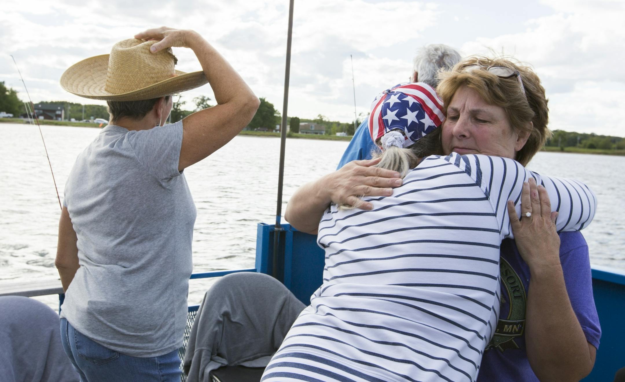 Twin Pines Resort co-owner Linda Eno hugs a customer during a fishing expedition on Mille Lacs Lake Monday, August 3, 2015.