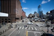 Pedestrians cross 1st Avenue N. at 6th Street in Minneapolis on Thursday. The city plans to reconstruct half a mile of 1st Avenue between Washington A