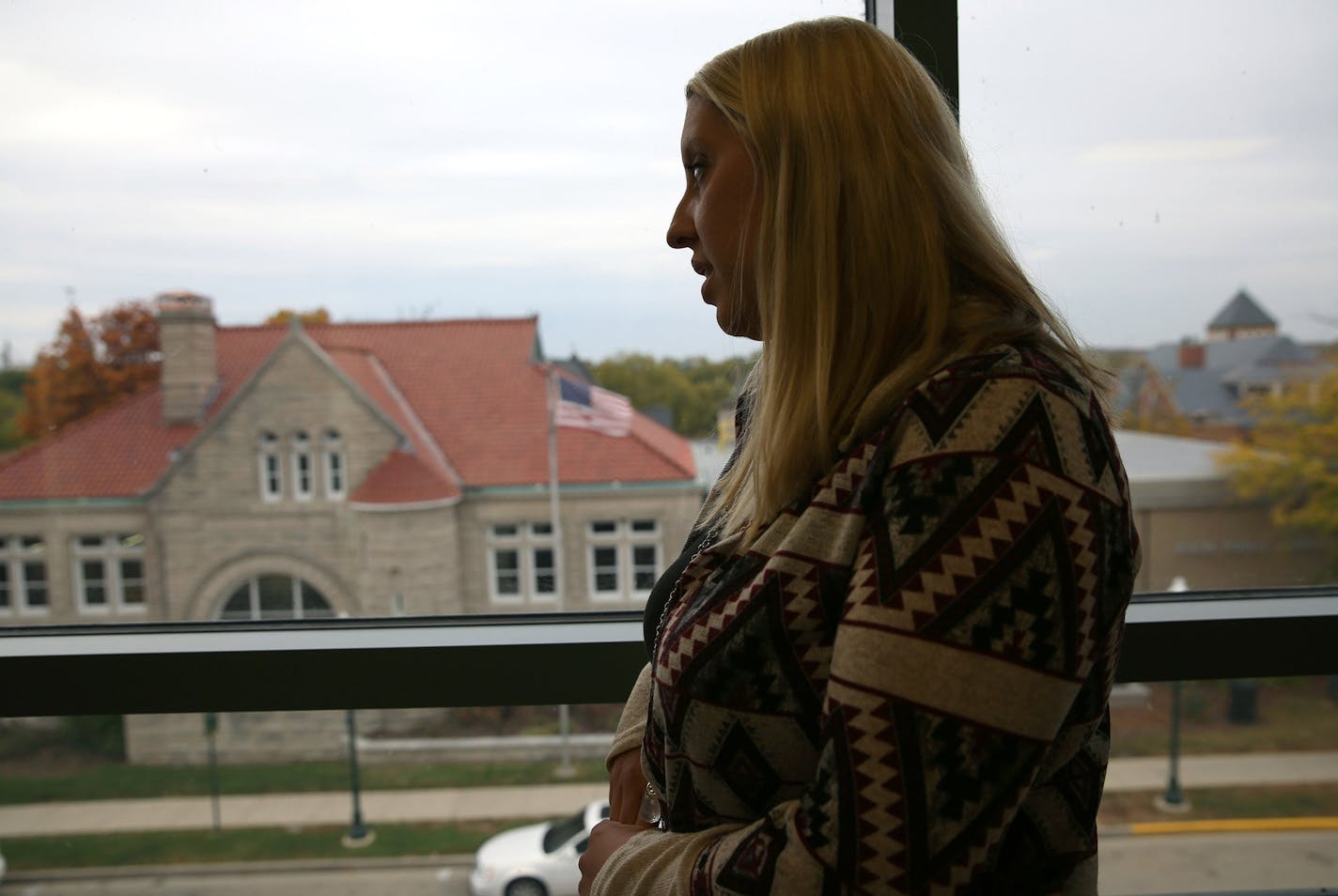 Alison White, 25, an ex-heroin user, stands inside the Dixon police station, which now helps transport users to rehab center, on Oct., 23, 2015 in Dixon, Ill. She is very proud to say that she's been clean for 4 years and 8 months. (Abel Uribe/Chicago Tribune/TNS)