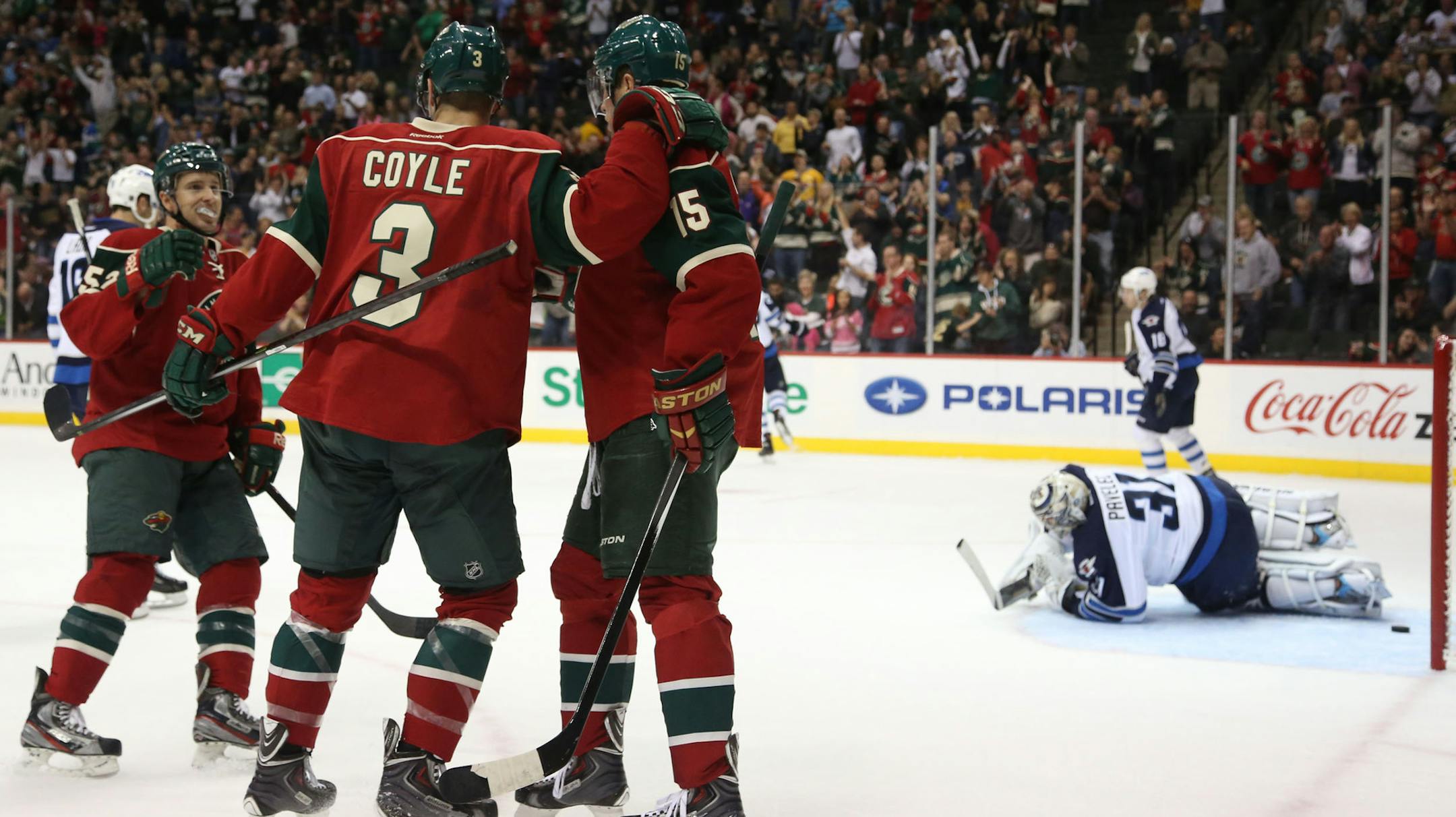 The Wild's Charlie Coyle celebrated with teammates after scoring the second Wild goal during the first period at Xcel Energy Center in St. Paul Saturday September 21, 2013. ] (KYNDELL HARKNESS/STAR TRIBUNE) kyndell.harkness@startribune.com