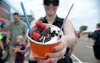 Monica Smith of Spring Lake Park displays her frozen yogurt sundae in all its glory at the Fro Yo Soul truck.