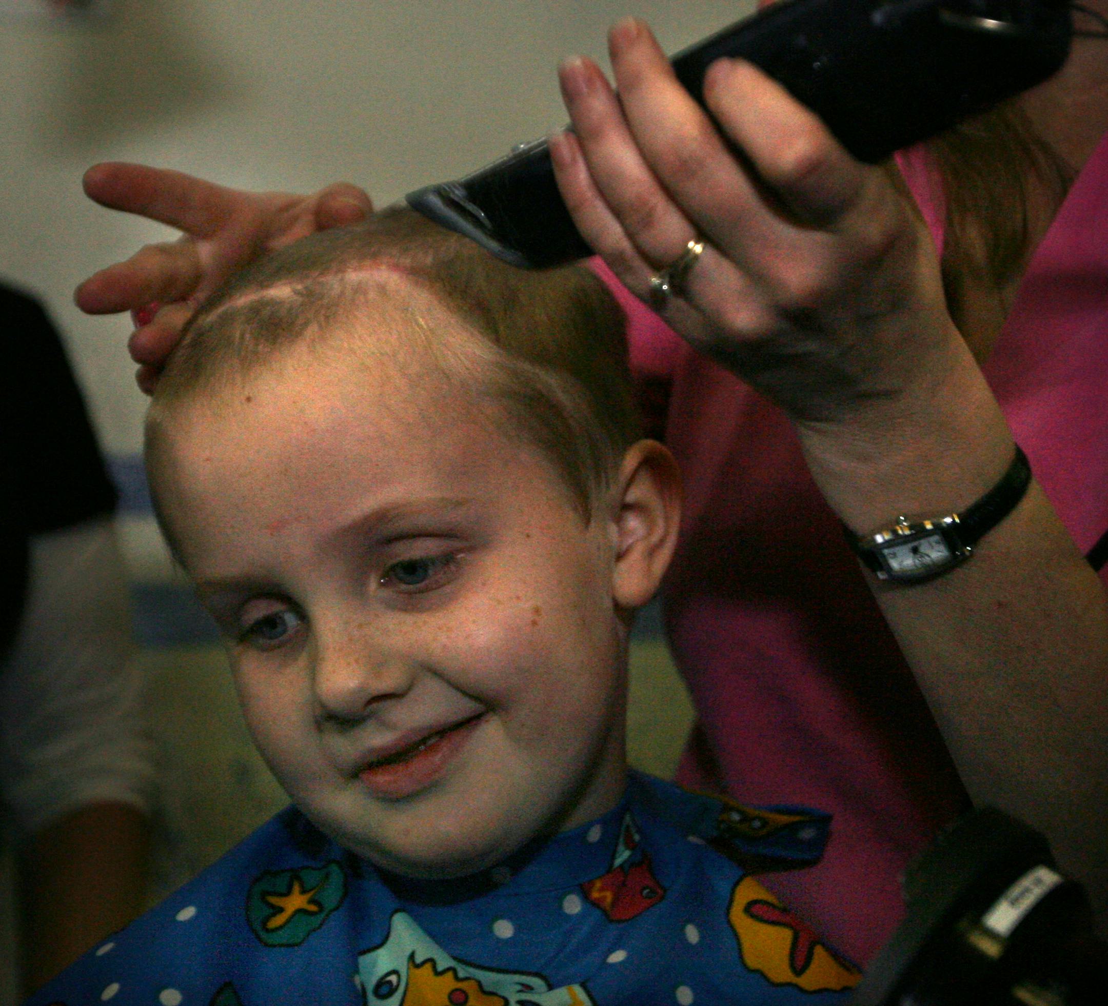 With his mother, Naomi, guiding the clippers, Fred Tilbury had his hair shaved off Friday. Fred began radiation treatments two weeks ago for the cancer that had branched around his brain and wrapped around his brain stem. The treatments might extend the 18 months that doctors have given him to live.