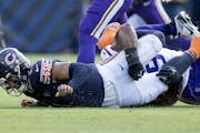 Bears quarterback Justin Fields suffered a hand injury on this sack by the Vikings’ Danielle Hunter in the third quarter.