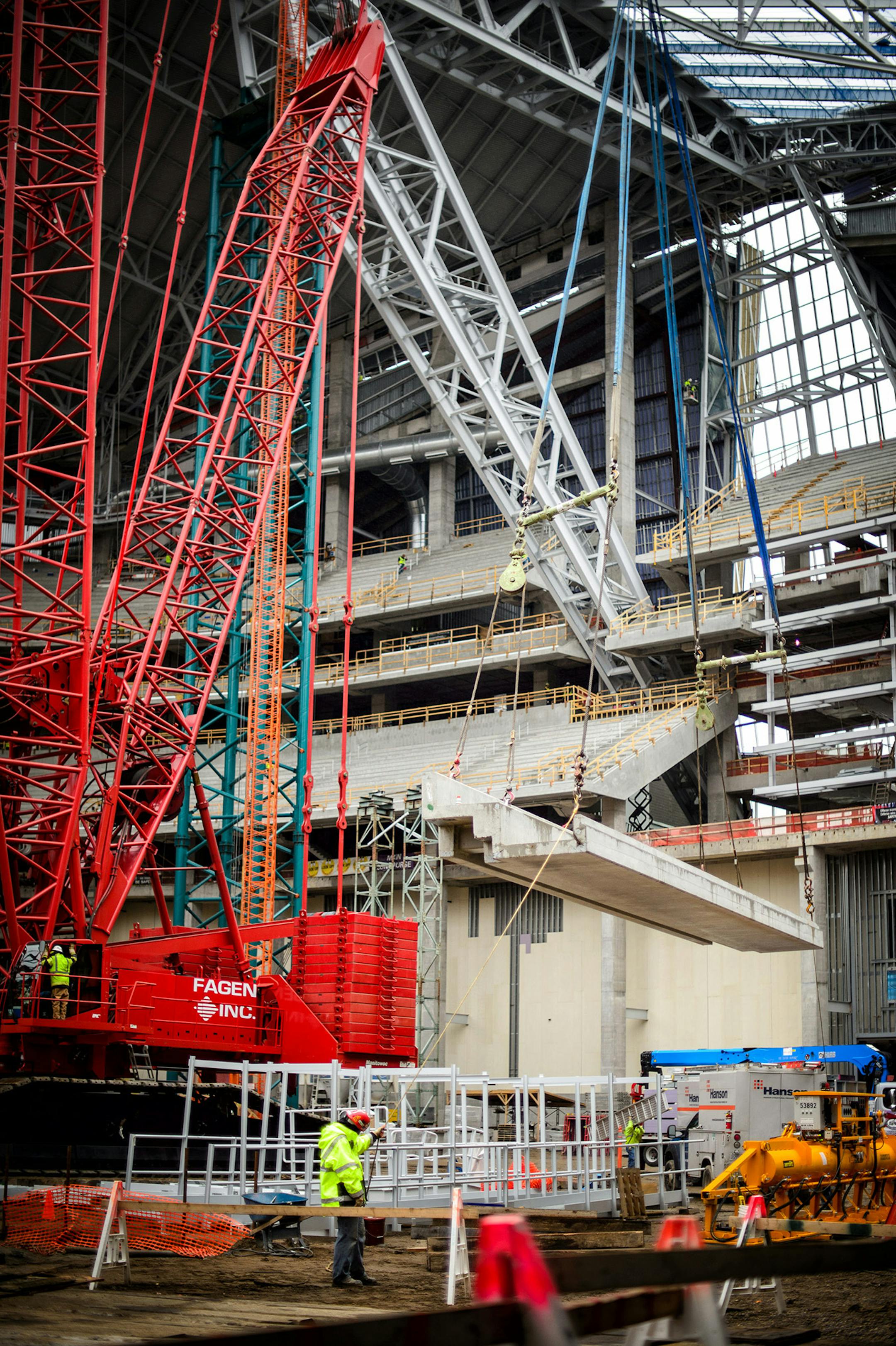 A concrete seating section panel is moved into position in the new Vikings stadium. Thursday, May 14, 2015 Construction update of the new Vikings stadium, Minneapolis, MN