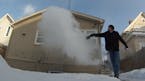 Nathan Ziegler throws boiling water in the cold air as part of his Minnesota Cold YouTube series.