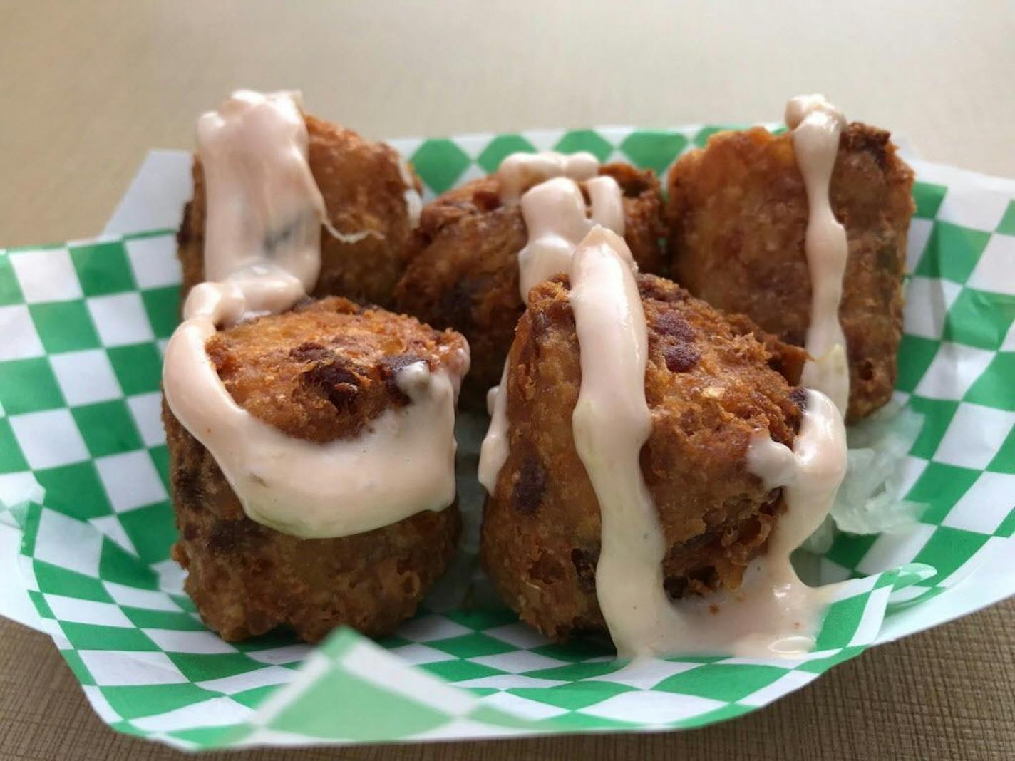 Irish Tater Kegs, O'Gara's at the Fair, Dan Patch/Cosgrove, $8. A good-on-paper idea that peppers jumbo (but soggy) Tater Tots with bits of corned beef and Swiss cheese, on a sauerkraut base. A salt bomb. Photo by Rick Nelson New food at the Minnesota State Fair 2018