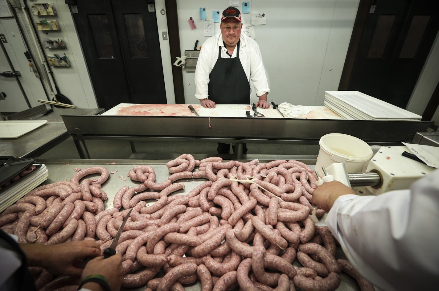 Spencer Gundhofer watched a batch of bloody Mary brats being made at Gundhofer's Old-Fashion Meats in Hugo, Minn. on Tuesday, July 1, 2014. ] RENEE JONES SCHNEIDER &#x2022; reneejones@startribune.com