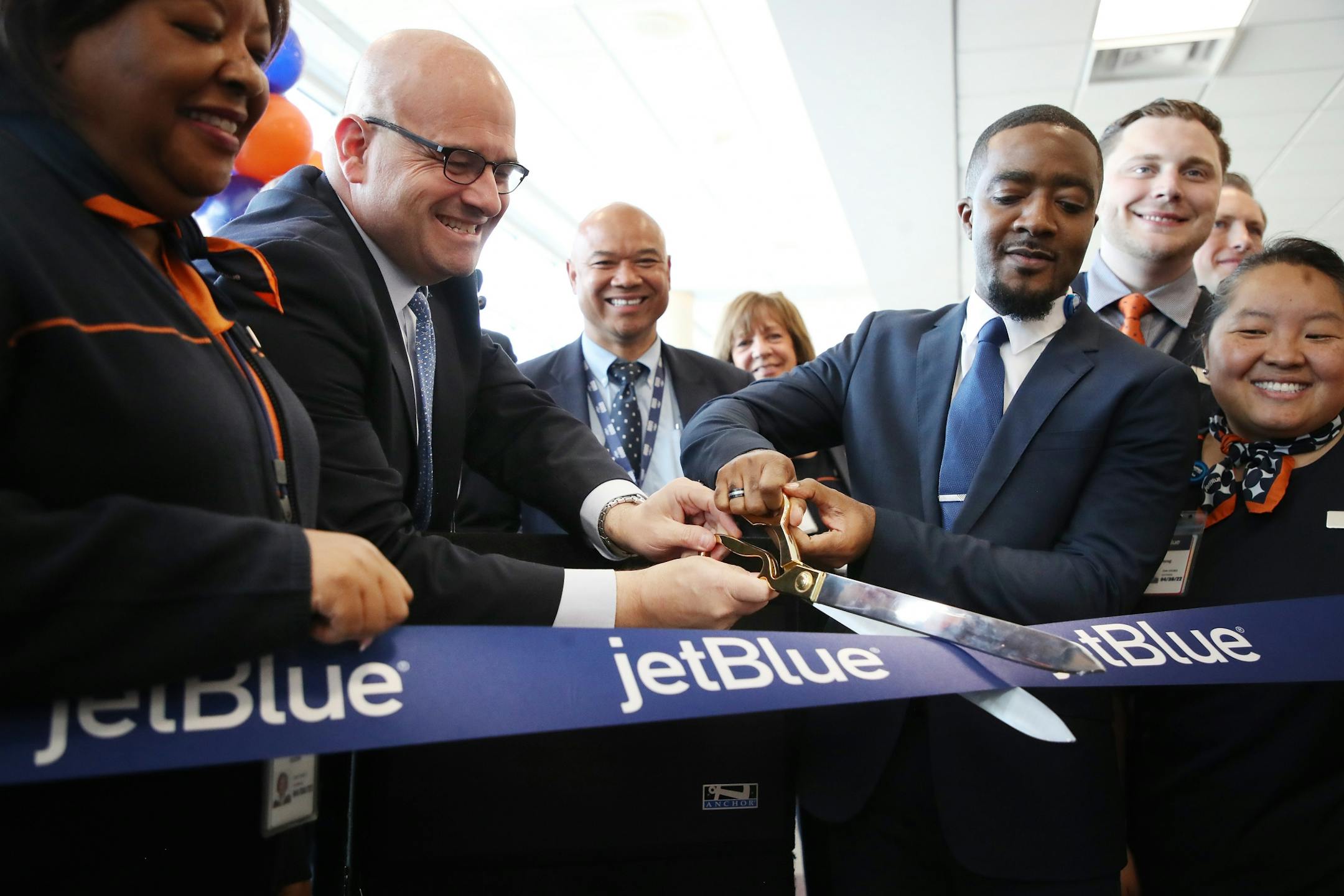Marty St. George - executive Vice President of commercial and planning left and Gladstone Adderley General Manager cut a ribbon for the start of JetBlue service at MSP Thursday May 3, 2018 Bloomington, MN.