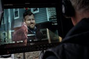 Director Patrick Coyle watched actor Adam Bartley work a scene in "Unholy Communion," a film rooted in St. Paul. Coyle wrote the script based off of l