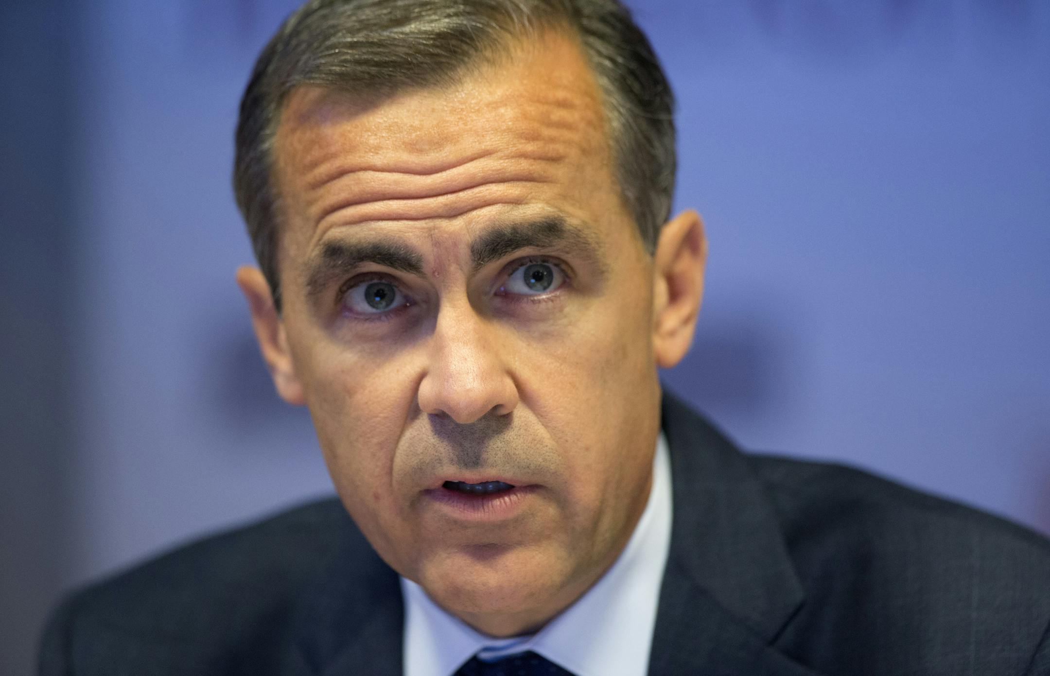 Bank of England governor Mark Carney speaks during a press conference for the bank's quarterly inflation report in London Wednesday Aug. 7, 2013. Mark Carney said Wednesday the U.K.ís central bank will not consider increasing its record-low interest rate or scaling back its bond-purchasing program until unemployment falls below 7 percent. Carney, delivering his first quarterly inflation report since he became governor, issued "forward guidance" on interest rates currently at 0.5 percent to