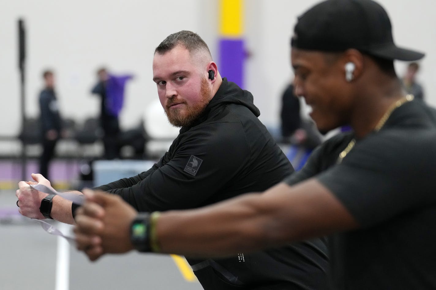 Minnesota Vikings guard Chris Reed (62) and fullback C.J. Ham (30) warm up ahead of a track and field competition Saturday, Jan. 28, 2023 at Minnesota State University's Myers Field House in Mankato, Minn. ] ANTHONY SOUFFLE • anthony.souffle@startribune.com