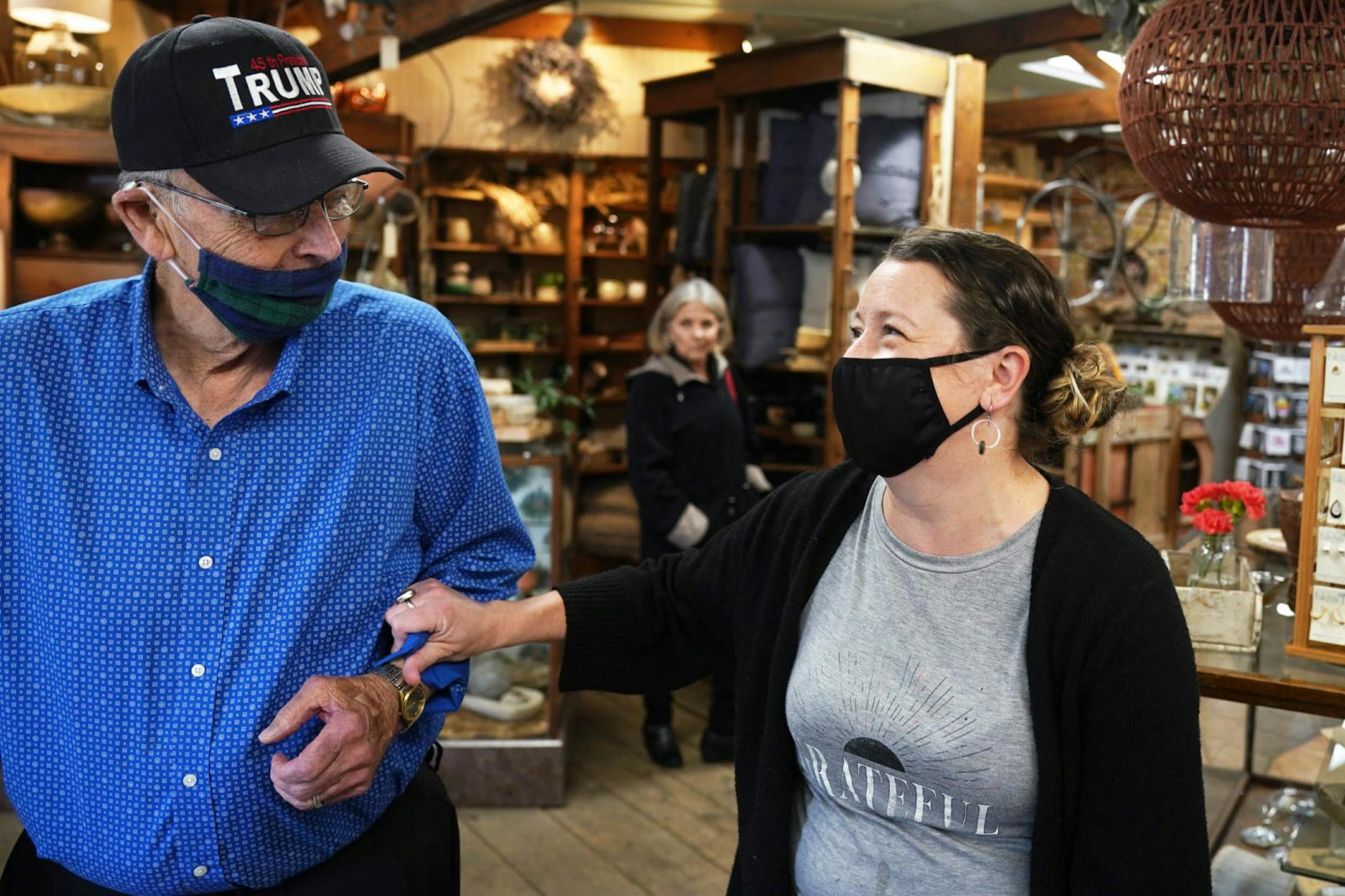 Ashlea Clifton, right, who moved from Minneapolis to Perham to take over the local coffee shop Gathering Grounds in August, joked with customer Dennis Flick of Alexandria after he and his wife stopped in for breakfast. Perham, home to Kenny's Candy Company where they make candy, potato chips and dog food, has a shortage of housing for all the people who have jobs there.