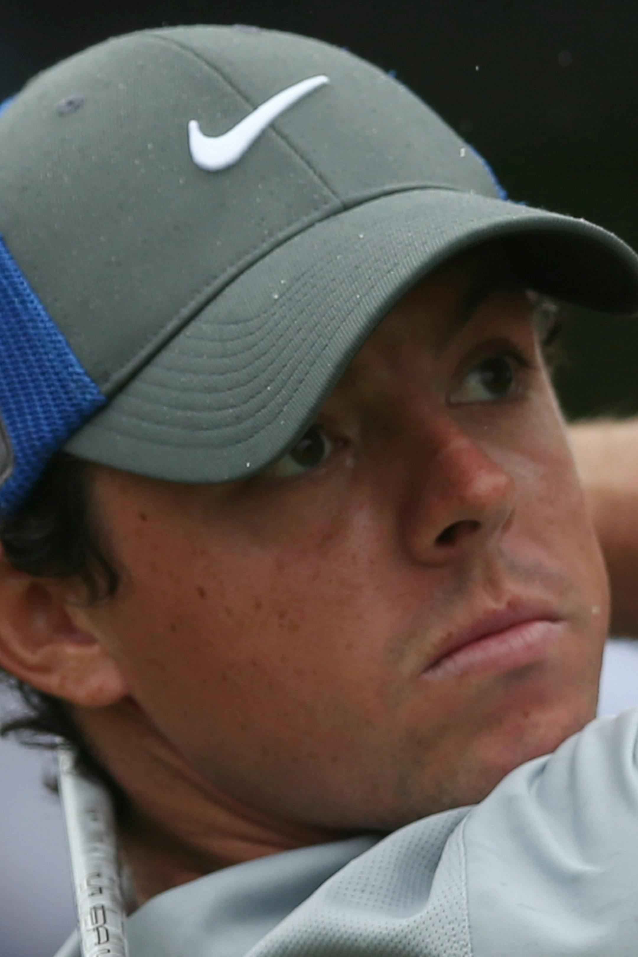 Rory McIlroy of Northern Ireland hits a shot from the 5th tee during the third day of the British Open Golf championship at the Royal Liverpool golf club, Hoylake, England, Saturday July 19, 2014. (AP Photo/Jon Super)