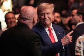 Former President Donald Trump, center right, talks to Dana White while attending the UFC 302 mixed martial arts event Saturday, June 1, 2024, in Newar