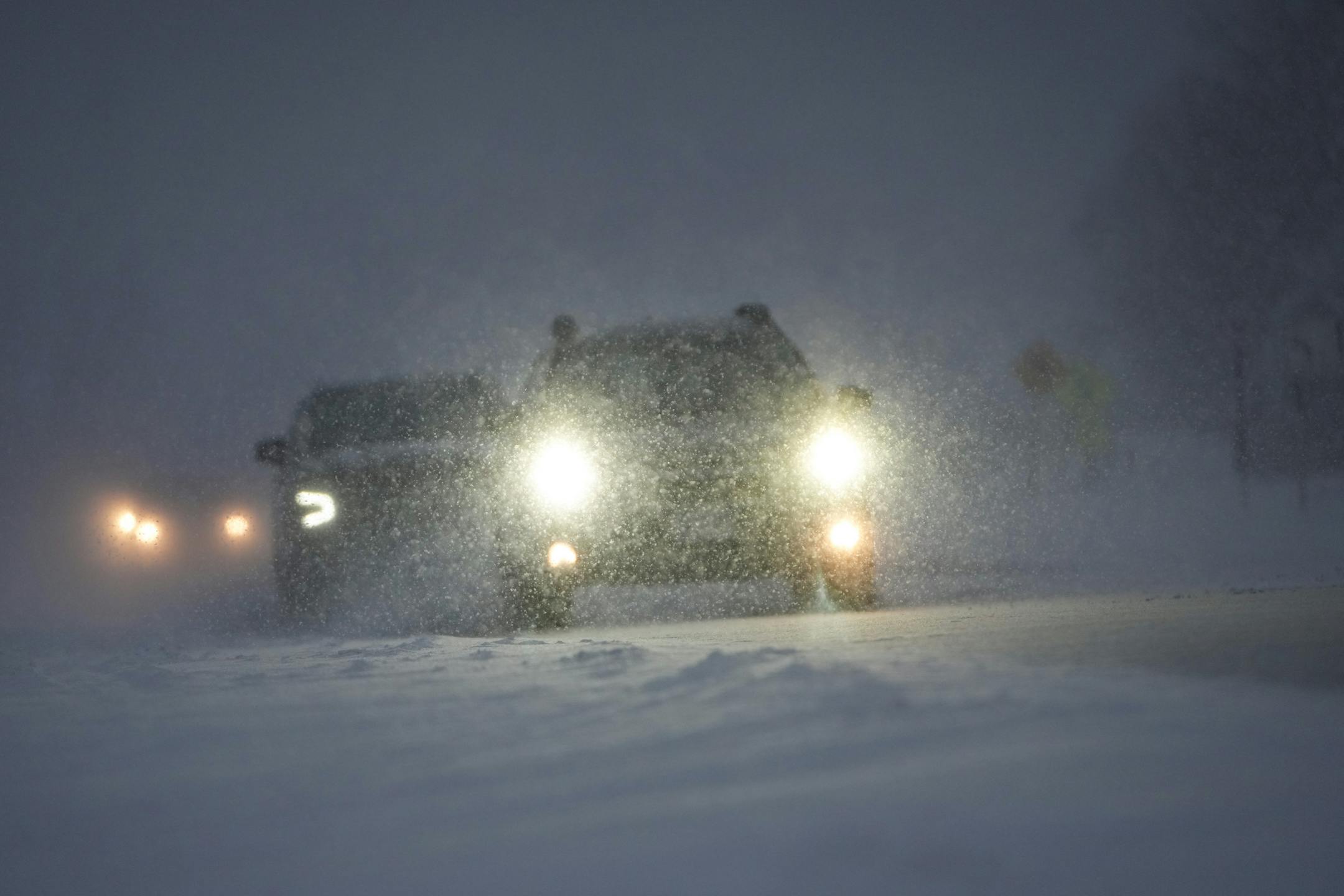 Winds pick up and drop visibility on County Road 101 at the start of a three-day snowstorm hitting the area days before Christmas in Medina, Minn., on Wednesday, Dec. 21, 2022.