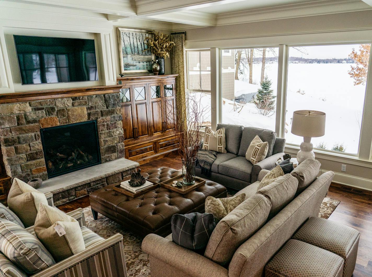 The living room has a wall of windows overlooking Lake Minnetonka.