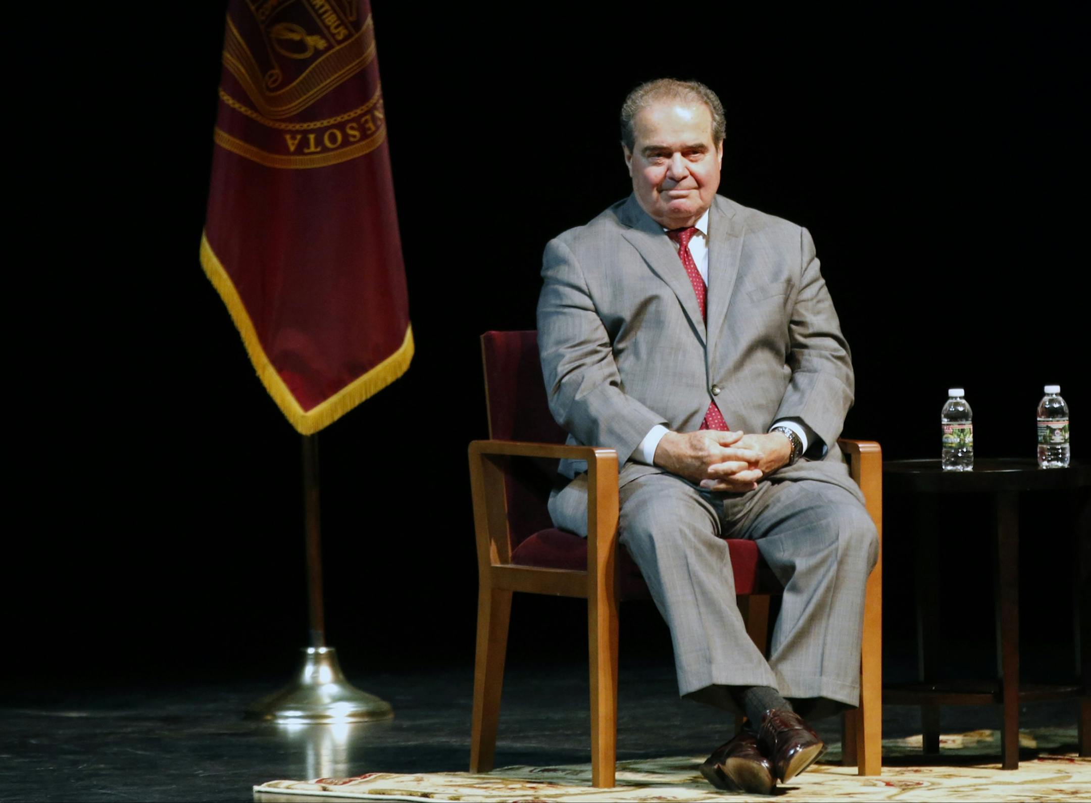 FILE - In this Oct. 20, 2015, file photo, U.S. Supreme Court Justice Antonin Scalia waits during an introduction before speaking at the University of Minnesota as part of the law school's Stein Lecture series in Minneapolis. The presence of three women on the Supreme Court isn't enough to persuade Scalia that the court has become a diverse body. In remarks Wednesday, Nov. 11, in Philadelphia, Scalia noted that four of its members are from New York City, a fifth from New Jersey and two more from