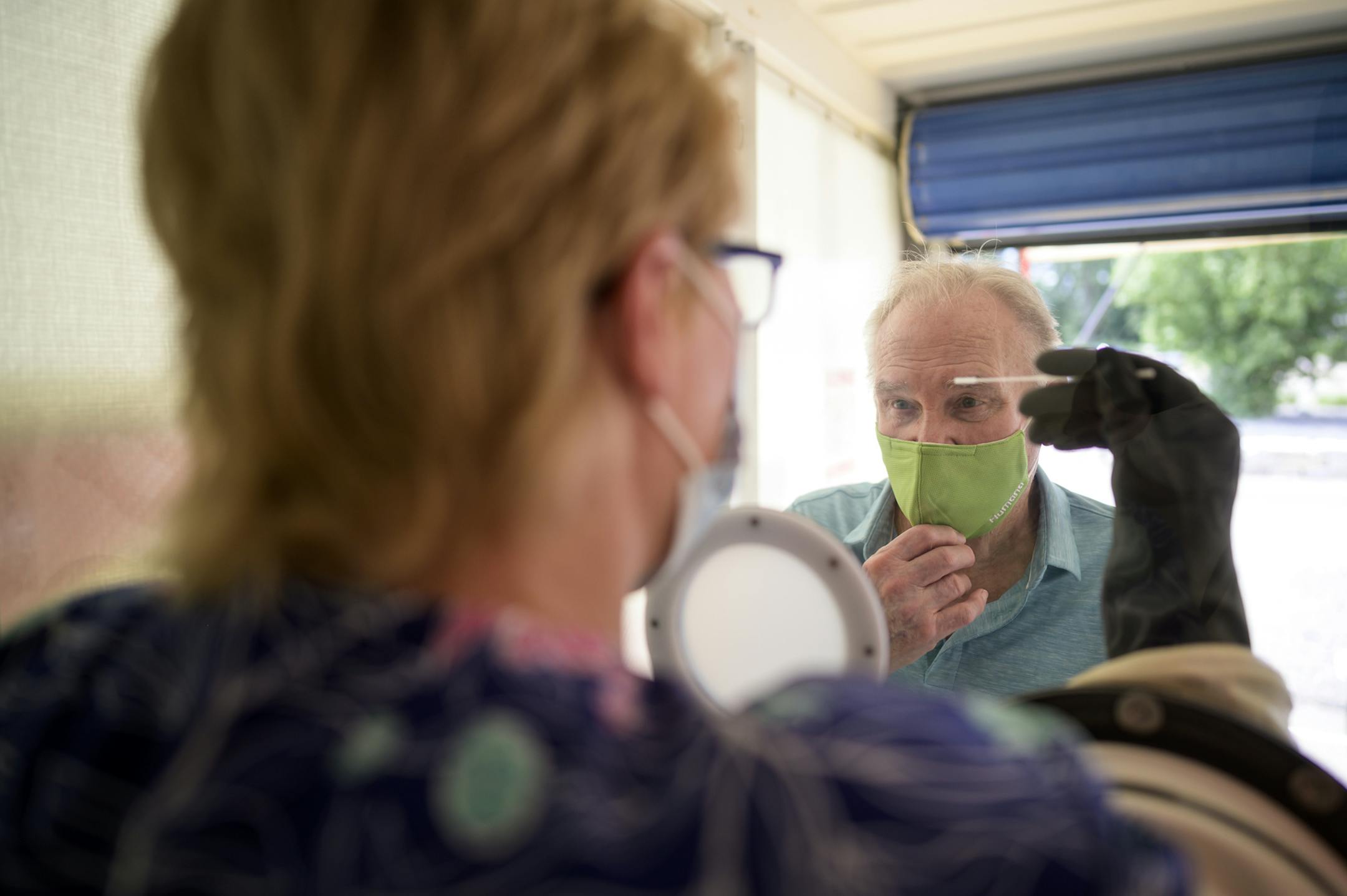 Albert Gartman, 84, of Forest Lake, was tested for COVID-19 by medical assistant Jeri Sanderson, Thursday afternoon at M Health Fairview's Wyoming Clinic. ] aaron.lavinsky@startribune.com Walk-up testing was offered at M Health Fairview's Wyoming Clinic on Thursday, Aug. 13, 2020 in Wyoming, Minn. A medical worker administered nasal swab tests in a glass booth designed by the University of Minnesota College of Science and Engineering. It's use is meant to offer more protection to the tester and
