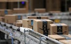 Packages passed down a conveyor belt before receiving a shipping label at Amazon in Shakopee, Minn. (Anthony Souffle/Minneapolis Star Tribune/TNS) ORG