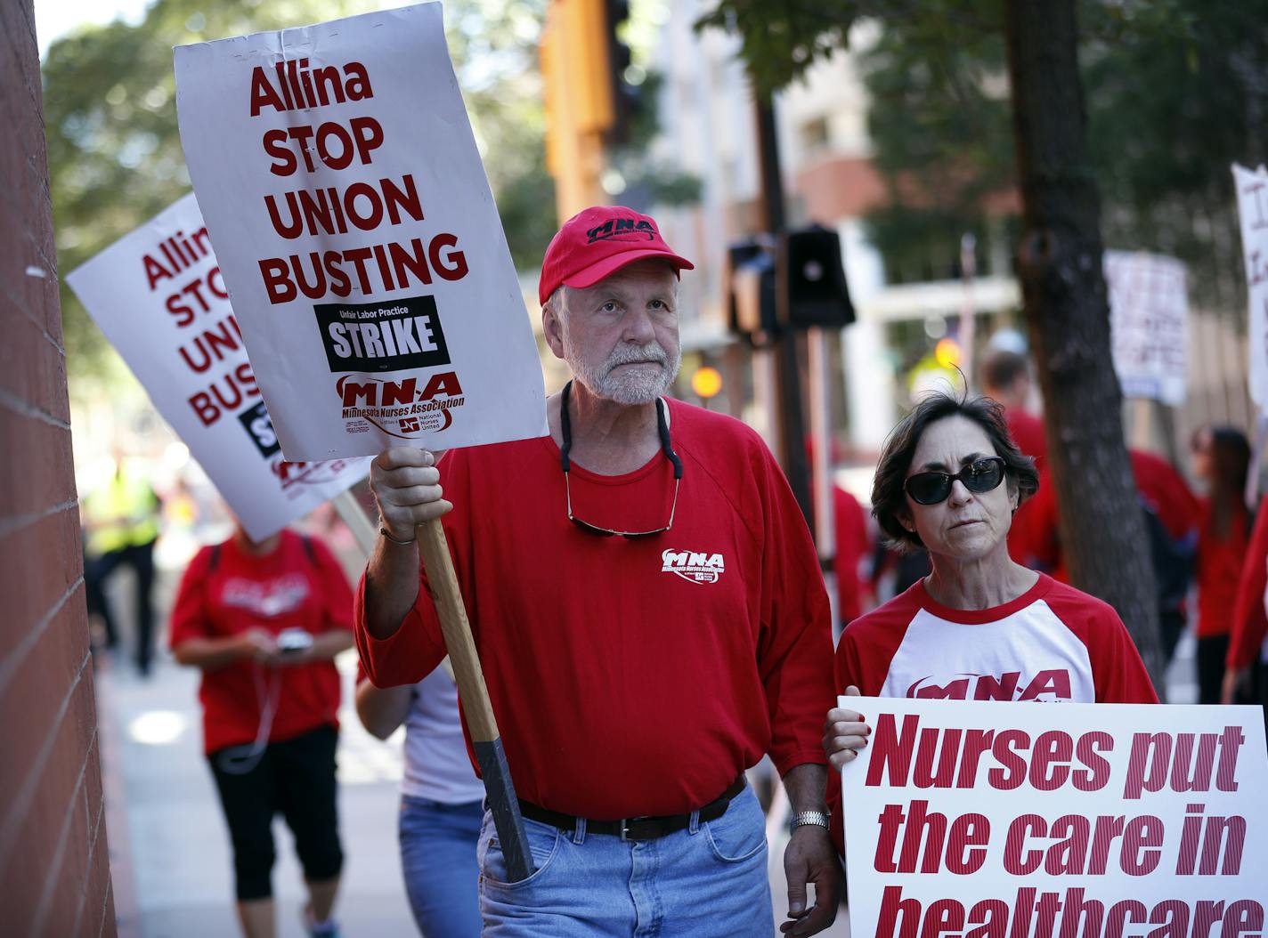 Mary Kay a labor and delivery nurse, walked with picket line with her husband Richard Hilden at United Hospital Sunday September 11, 2016 in St. Paul, MN. ] Jerry Holt / jerry. Holt@Startribune.com