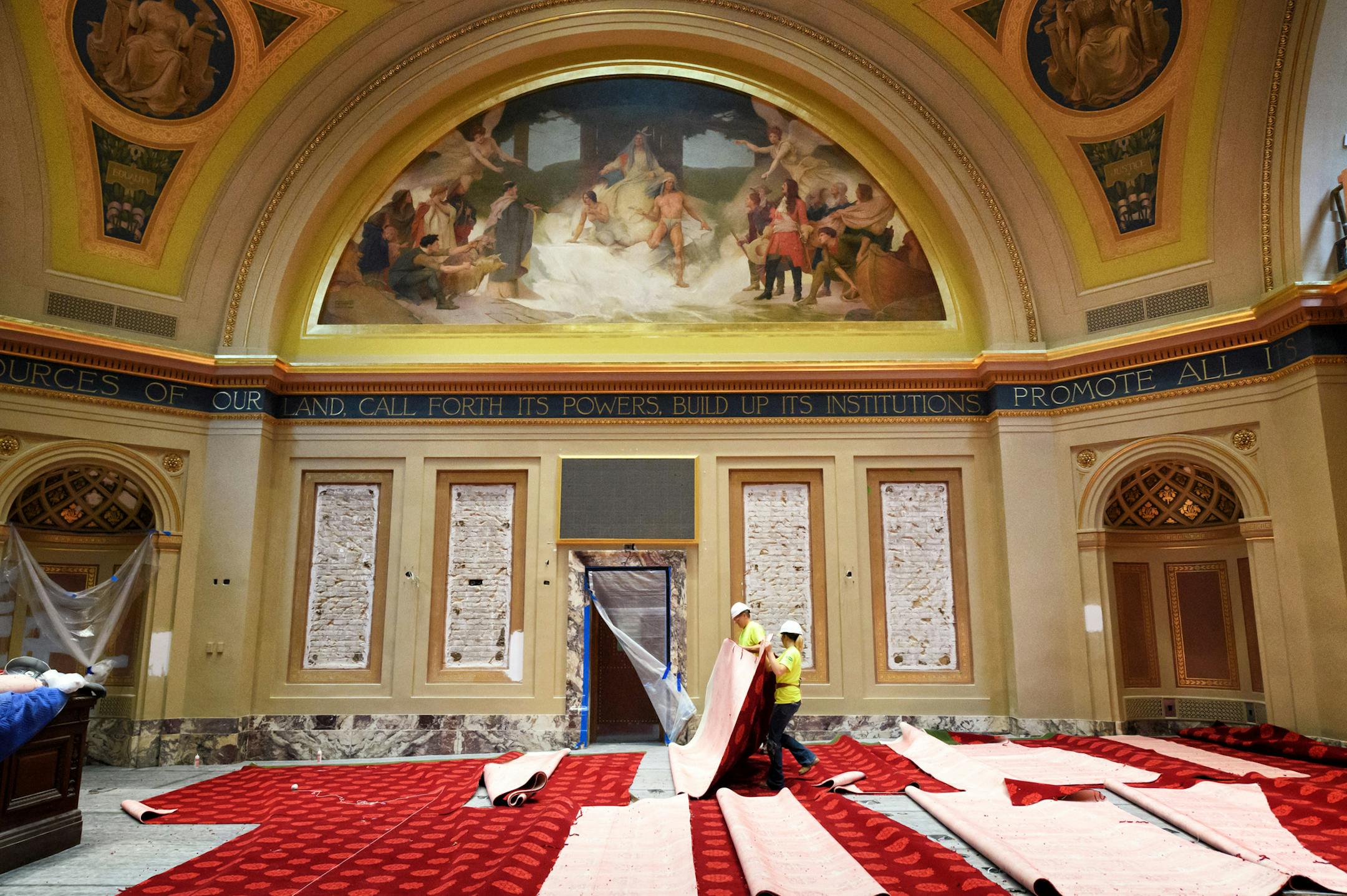 The traditional red carpeting of the Senate Chamber is being replaced, and newly restored murals are as bright as they were in 1905.
