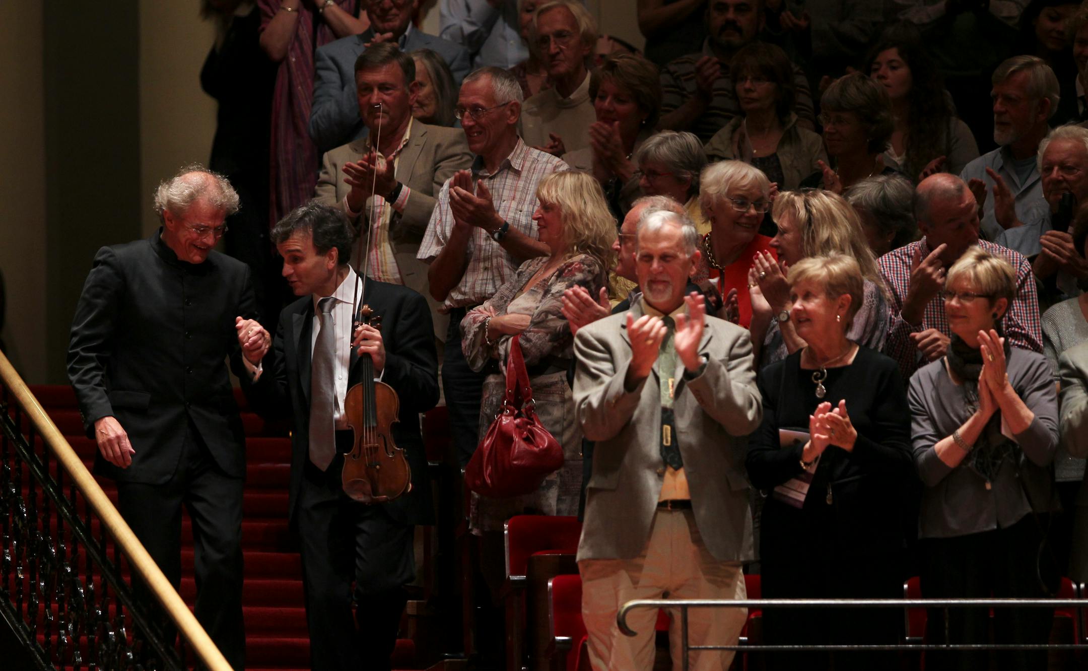 Osmo Vänskä, left, and violinist Gil Shaham basked in applause at the Concertgebouw in Amsterdam after Shaham and the Minnesota Orchestra played an encore of traditional Turkish tunes. Earlier in the Aug. 30, 2010 concert, Shaham soloed on Mozart's "Turkish" Concerto.