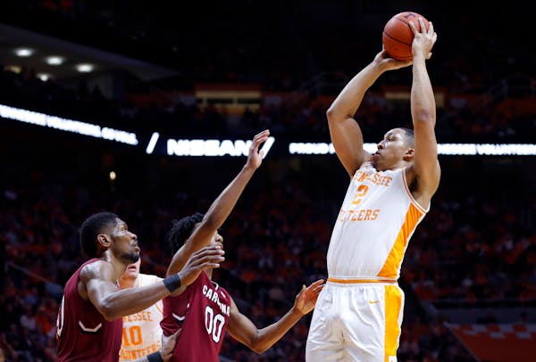 Tennessee’s Grant Williams shot over South Carolina guard A.J. Lawson (00) and forward Chris Silva (30) during a game in 2019. 