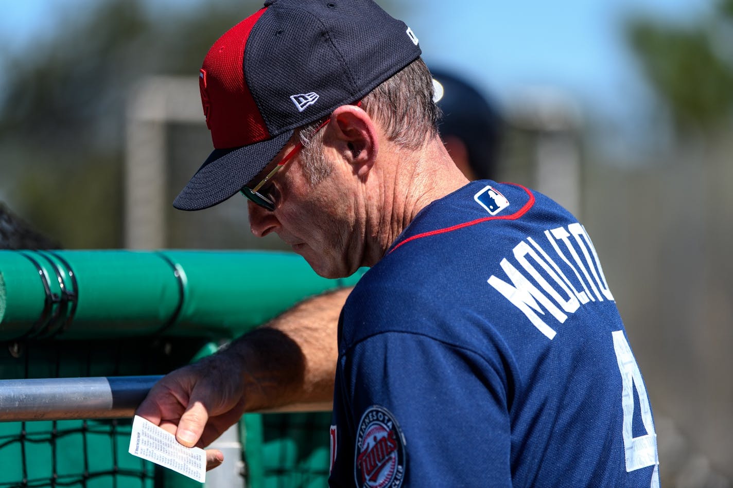 Minnesota Twins manager Paul Molitor (4) referenced his roster during live batting practice Monday.